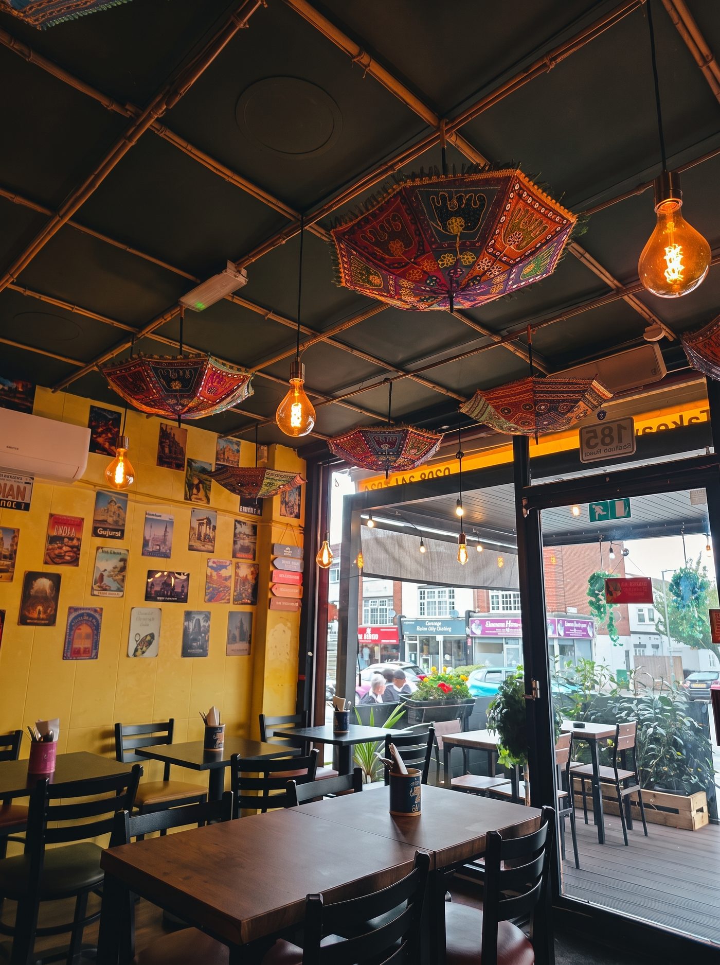 The yellow dining room under paper umbrellas